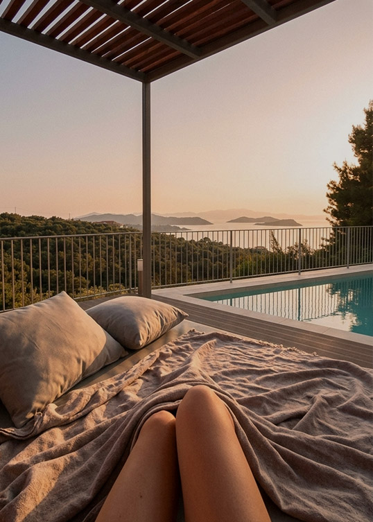 Outdoor lounge area with sea view and private jacuzzi
